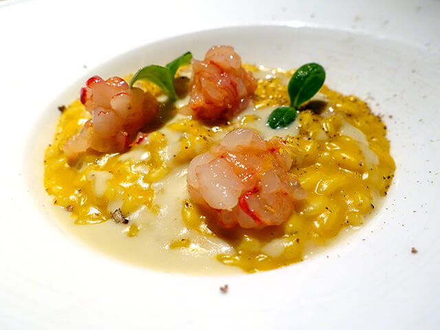 Risotto alla zucca, battuta di gamberi rossi, crema al gorgonzola e polvere di noce moscata Pumpkin risotto, red prawns tartare, gorgonzola cheese sauce, nutmeg powder
